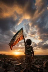 Fotobehang Indian Boy Holding indian Flag at Sunset © David Zarzosa