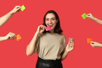 Young woman and hands with condoms on red background. Safe sex concept