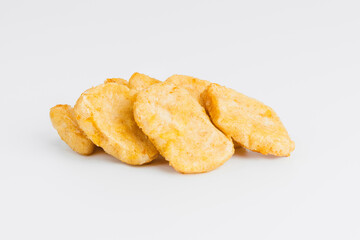Breaded Chicken Inner Fillet on a White Background,Chicken Breaded Raw Meat.Chicken Breaded Fillet.Fast food. Fast cooking. Breaded chicken nuggets. Homemade food at home.
