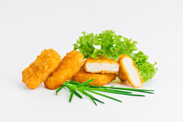 Breaded chicken nuggets.Breaded Chicken Inner Fillet with green lettuce leaves on a White Background.Chicken Breaded Raw Meat,Fillet.Fast homemade food at home. Chicken breaded schnitzels.Fast cooking