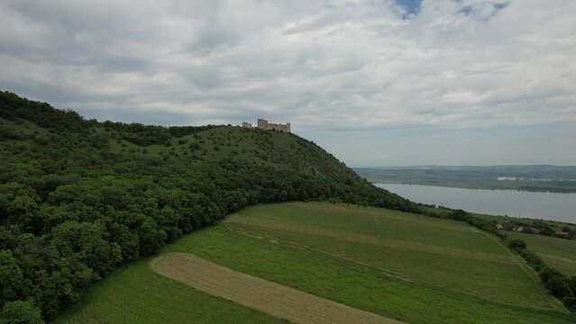 aerial panorama view of gothic Devicky castle,Palava hills,Protected Landscape Area (Chr&aacute;něn&aacute; krajinn&aacute; oblast P&aacute;lava) Devicky, Palava, Moravia region,Pavlovske vrchy, Czech Republic