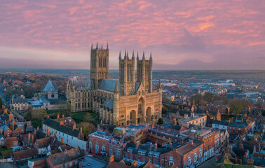 Lincoln, UK. Cathedral and City at sunset. Aerial view of the British city of Lincoln United Kingdom. Steep Hill and historic church - 685914352
