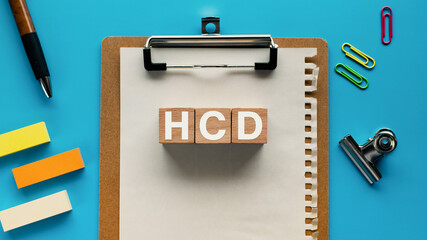 There is wood cube with the word HCD. It is an abbreviation for Human Centered Design as eye-catching image.