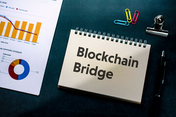 There is notebook with the word Blockchain Bridge. It is as an eye-catching image.