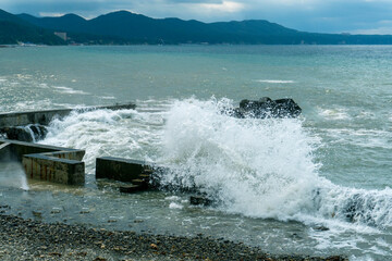 small storm on the sea, waves hitting the shore