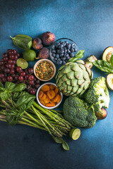 Variety of fresh raw organic fruits and vegetables.  Health foods high in protein vitamins, antioxidants, anthocyanins, fibre.colorful fresh group of vegetables for a balanced diet.