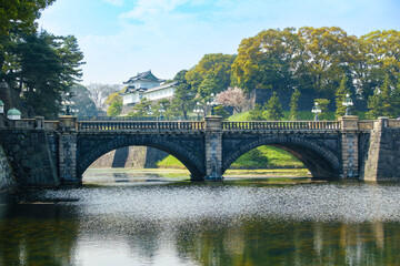 Fototapeta na wymiar Nijubashi or Megane Bashi bridge, structure made of stone and curves, Imperial Palace or Kokyo is Emperor Residence, in past Edo Castle is of Shogun, Japanese Garden. Tourism landmark in Tokyo Japan.