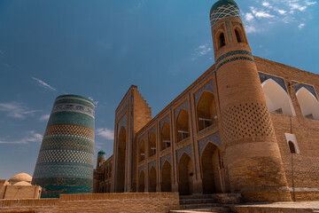 Ancient Kalta-Minor minaret in urban landscape on a sunny day