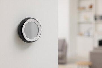 One thermostat on white wall indoors, space for text. Smart home system - obrazy, fototapety, plakaty