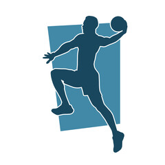 Fototapeta na wymiar Silhouette of a basket ball player in action pose. Silhouette of a male basket ball athlete.