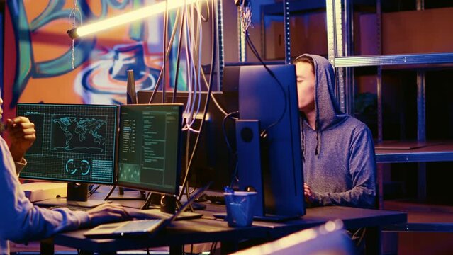 Hackers in underground hideaway utilizing technical knowhow of bugs and exploits to break into computer systems and access valuable data, bypassing firewalls and login process