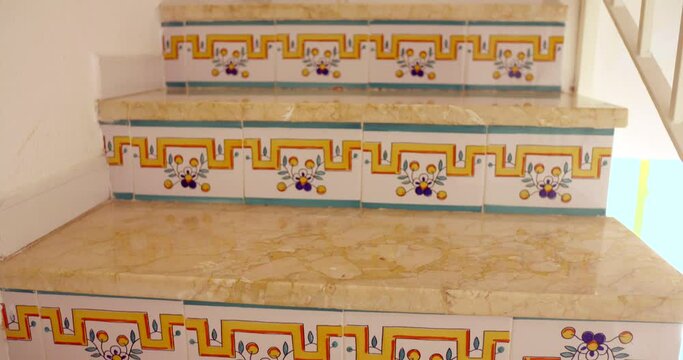 Typical Spanish Ceramic Tiles On Stair Risers Inside A Home In Spain. - tilt down shot