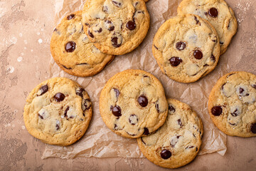 Chocolate chip cookies freshly baked on parchment paper