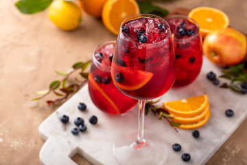 Refreshing summer berry sangria with apples, oranges and blueberry