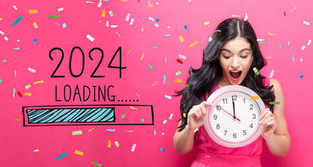 Loading new year 2024 with young woman holding a clock showing nearly 12 - obrazy, fototapety, plakaty