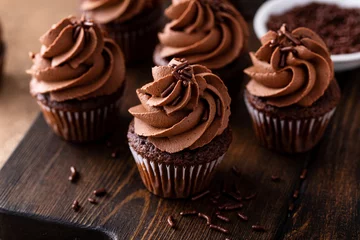 Tuinposter Dark chocolate cupcakes with chocolate ganache frosting © fahrwasser