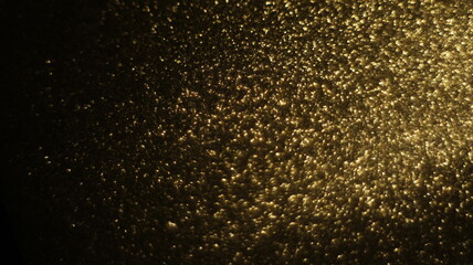 Fototapeta na wymiar Golden Glitter Bokeh - Radiant and Shimmering Light Effects, Ideal for Adding a Touch of Luxury and Sparkle to Various Creative Projects.