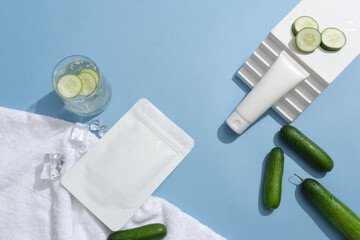 Blue background featured cucumbers and slices of cucumber with ices. Vitamin C is a prominent...