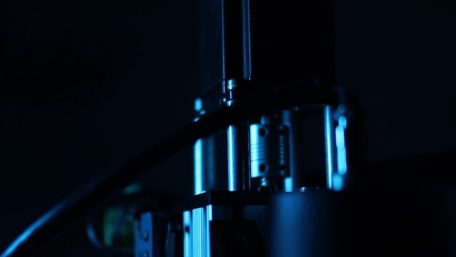 cnc router, spindle, stepper motors, close-up, dark background, blurred