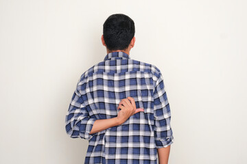 Back view of a man scratching his back with hand - obrazy, fototapety, plakaty