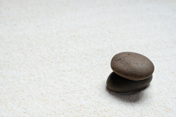 	
Top view of three stones resting on sandstone balance concept, Japanese Zen garden