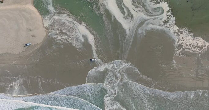 Aerial Top Down Drone shot of Truck Driving on Pismo Beach California at Sunrise