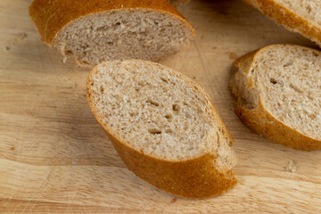 fresh wheat bread with bran on the cutting board