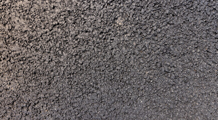 a close-up of a part of a new paved road