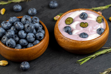 fresh purple and white yogurt with blueberries and blueberry berry flavor