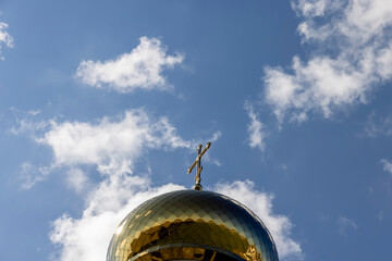 wooden christian cross on a blue sky background