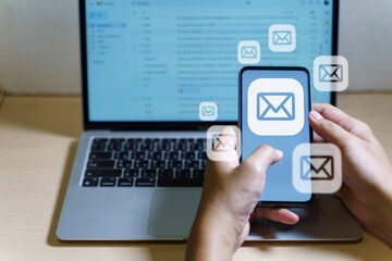 Email marketing concept. Hand of businessman using smartphone , tablet, for email virtual screen. Business digital technology and marketing.	
