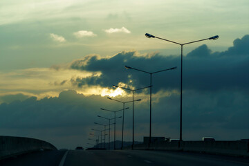 Road bridges and light pole on sunset sky scenery. silhouette.