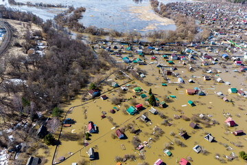 Flooded summer cottages during the spring flood of the river, aerial view of the flood in the...