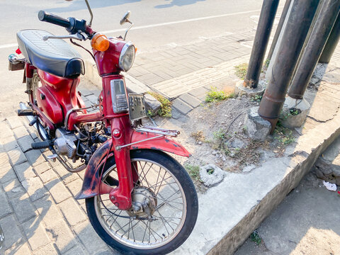 Yogyakarta, Indonesia - November 8, 2023: Honda Super Cub (or Honda Cub) is a Honda underbone motorcycle with a four-stroke single-cylinder engine.  Honda Pitung or Super Cub C70.