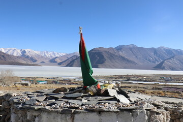 Frozen Pangong  Lake in  Ladakh with buddhist stupa and village - obrazy, fototapety, plakaty
