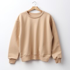 Beige color crew-neck sweatshirt lying flat and folded on top of a white background