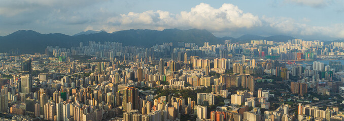 Panoramic view of Hong Kong City before sunset or sunrise. View of financial district high-rise and residential buildings during sunset or sunrise time from view point Observation.