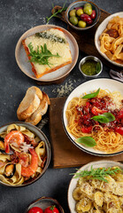Assortment of Italian pasta with traditional sauces for dinner. Homemade food concept.