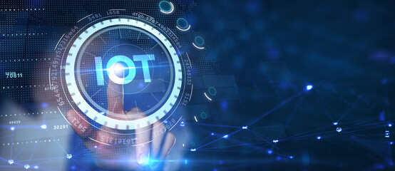 Internet of things - IOT concept. Businessman offer IOT products and solutions. The future of technology. Virtual screen of the future with the inscription: IOT.