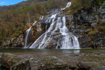 autumn landscape view of the Cascata delle Sponde waterfall near Someo in the Ticino in Switzerland