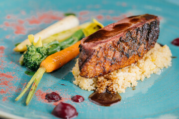 Muscovy Duck Breast with mashed potato and salad of radish, carrot and broccoli served in dish isolated on table top view of meat main course arabic food