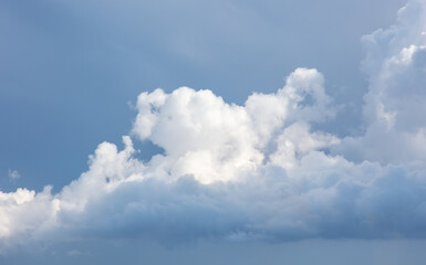 Obraz premium White clouds on a blue sky as a background