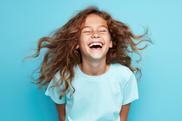 cute girl laughing cheerful isolated blue pastel color background - obrazy, fototapety, plakaty