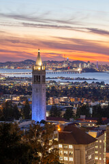 Sather Tower in UC Berkeley and San Francisco City Skyline at Sunset