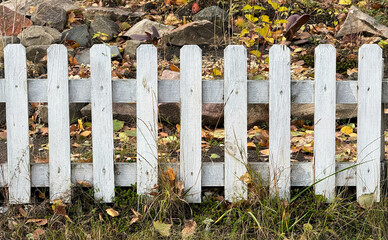 White wooden fence in nature. Background