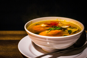 Tom Yum Clear Soup (Seafood) with squid, prawns, straw mushrooms, lemongrass