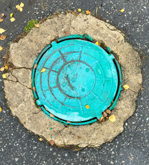 Sewer hatch on the ground in the park