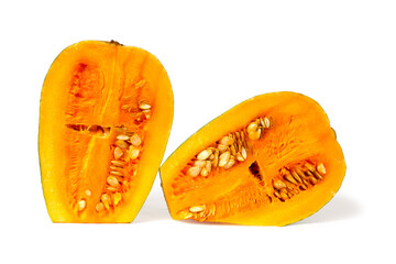 Pumpkin halves with seeds on white background. Natural organic pumpkin.