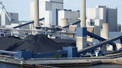 New technology coal fired power stations throughout Europe-transmission towers and wind turbines generate and transport electricity