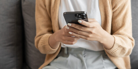Asian woman Search for information on Internet in smartphone with holding bottled drug. girl reading information online on mobile phone medicine healthcare product concept.